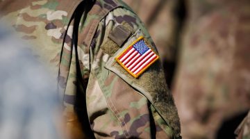 A photo of an American flag patch on a military uniform