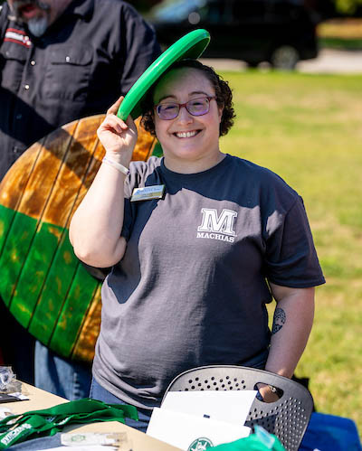 A photo of Hope Shore standing at a table at the 2022 club fair