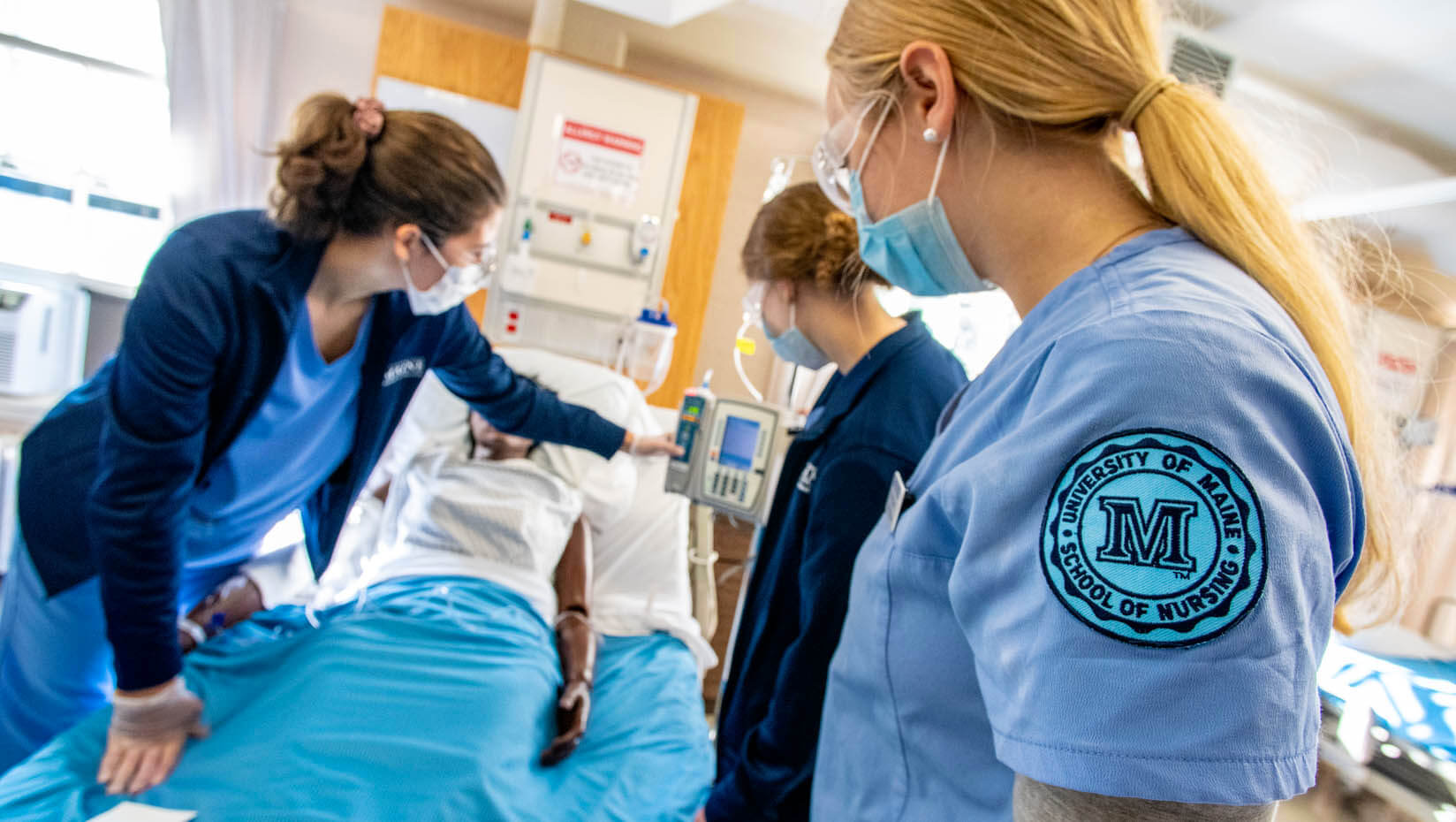 A photo of nursing students working in a skills lab
