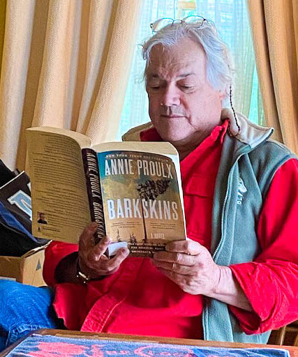 A photo of a person reading a book