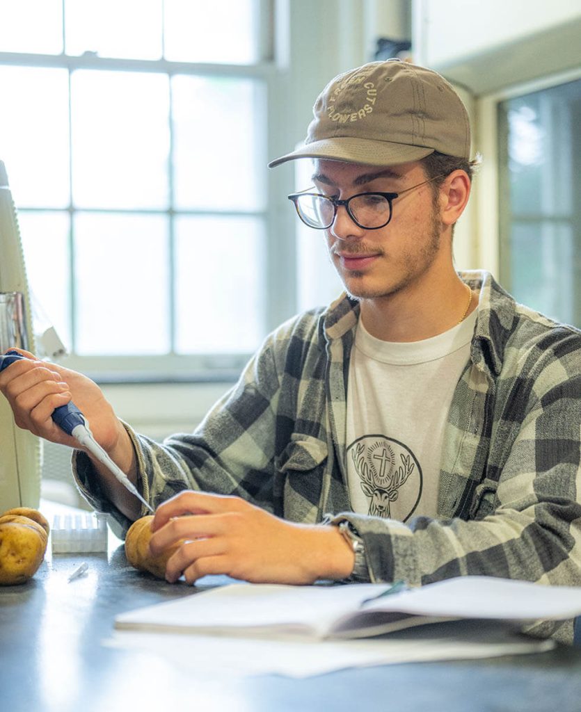 A photo of Will Kolbenson in a lab