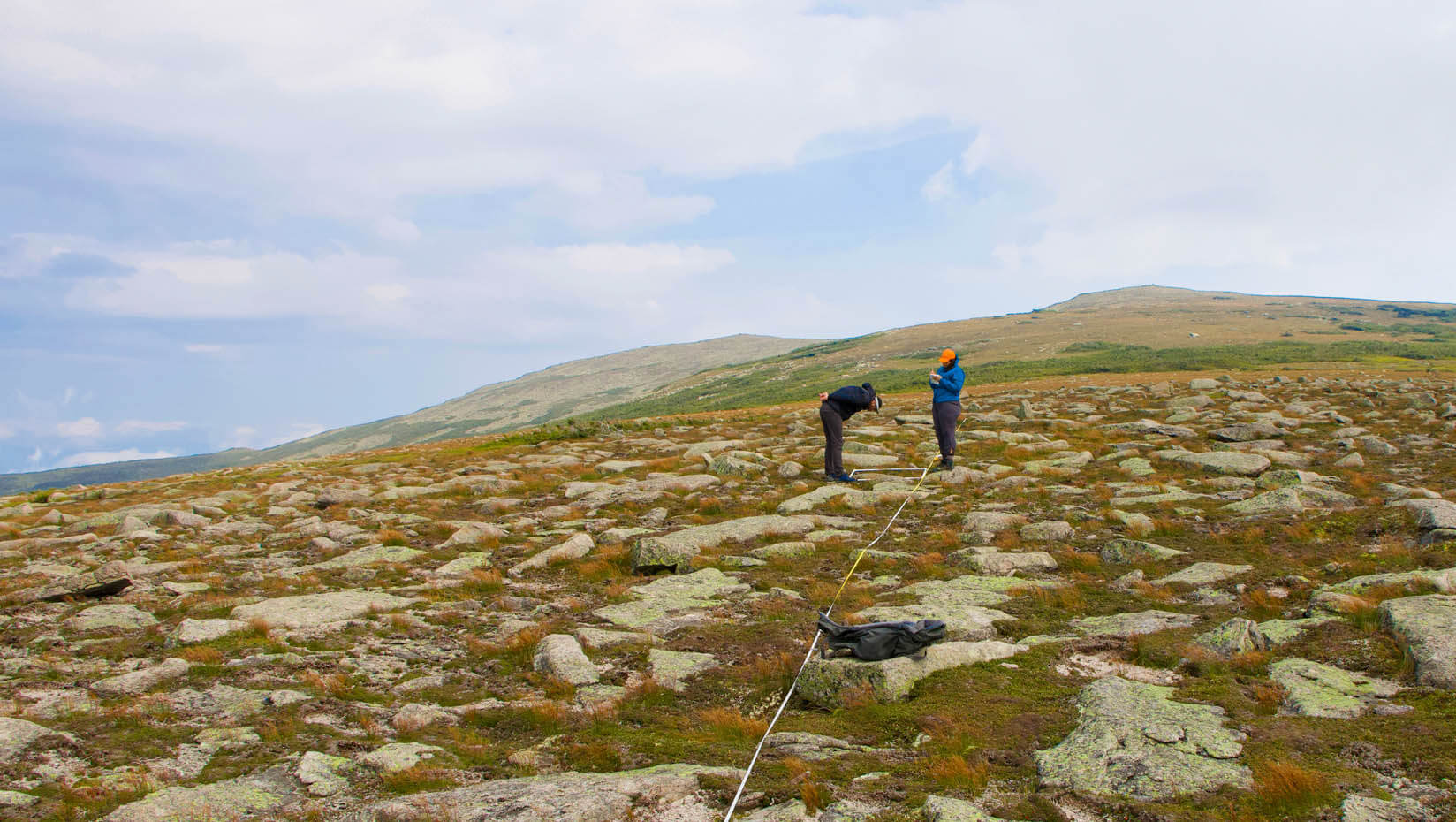 A photo of researchers on a mountain top