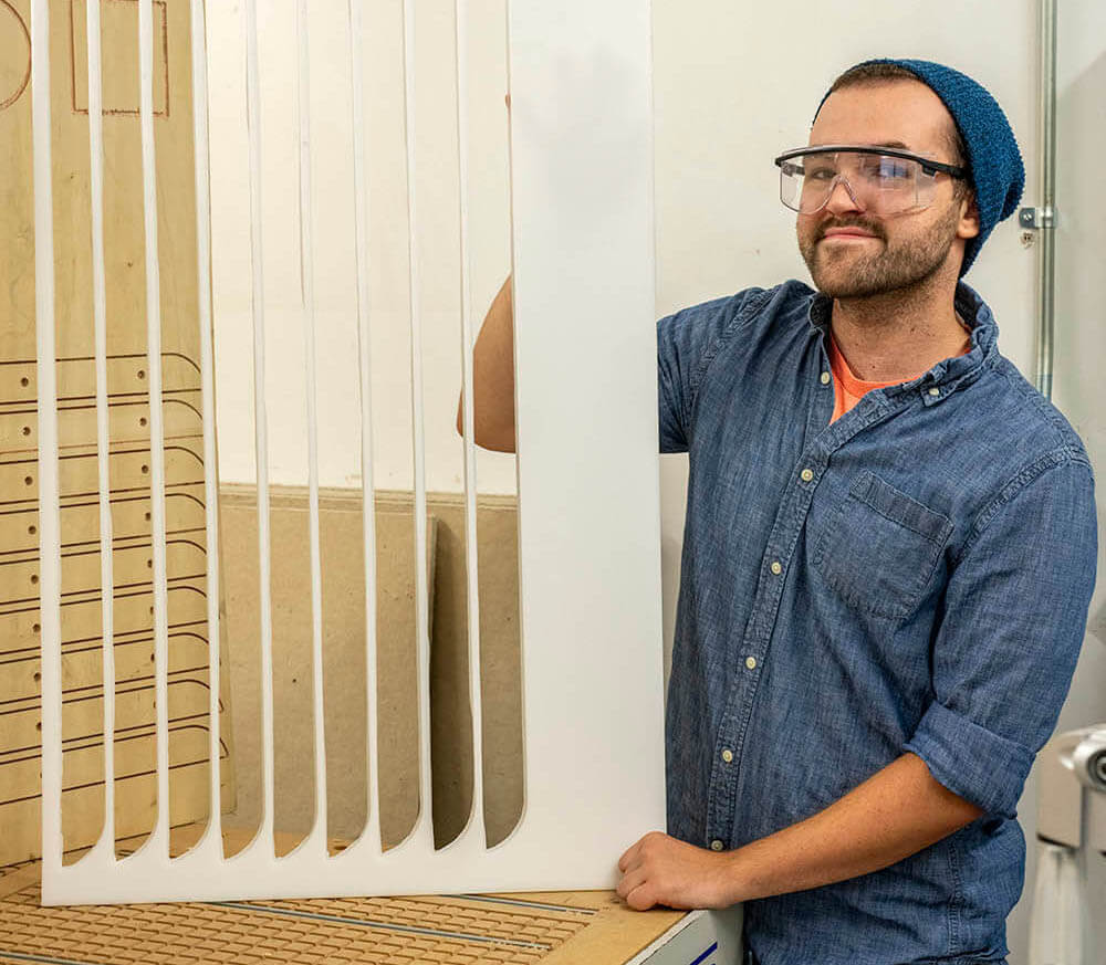 A photo of a person posing with a cutout device