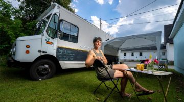 A photo of Merrilee Schoen sitting outside the Joy Truck