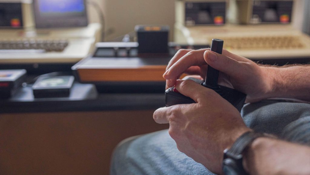 A photo of Vincent Weaver holding a game controller