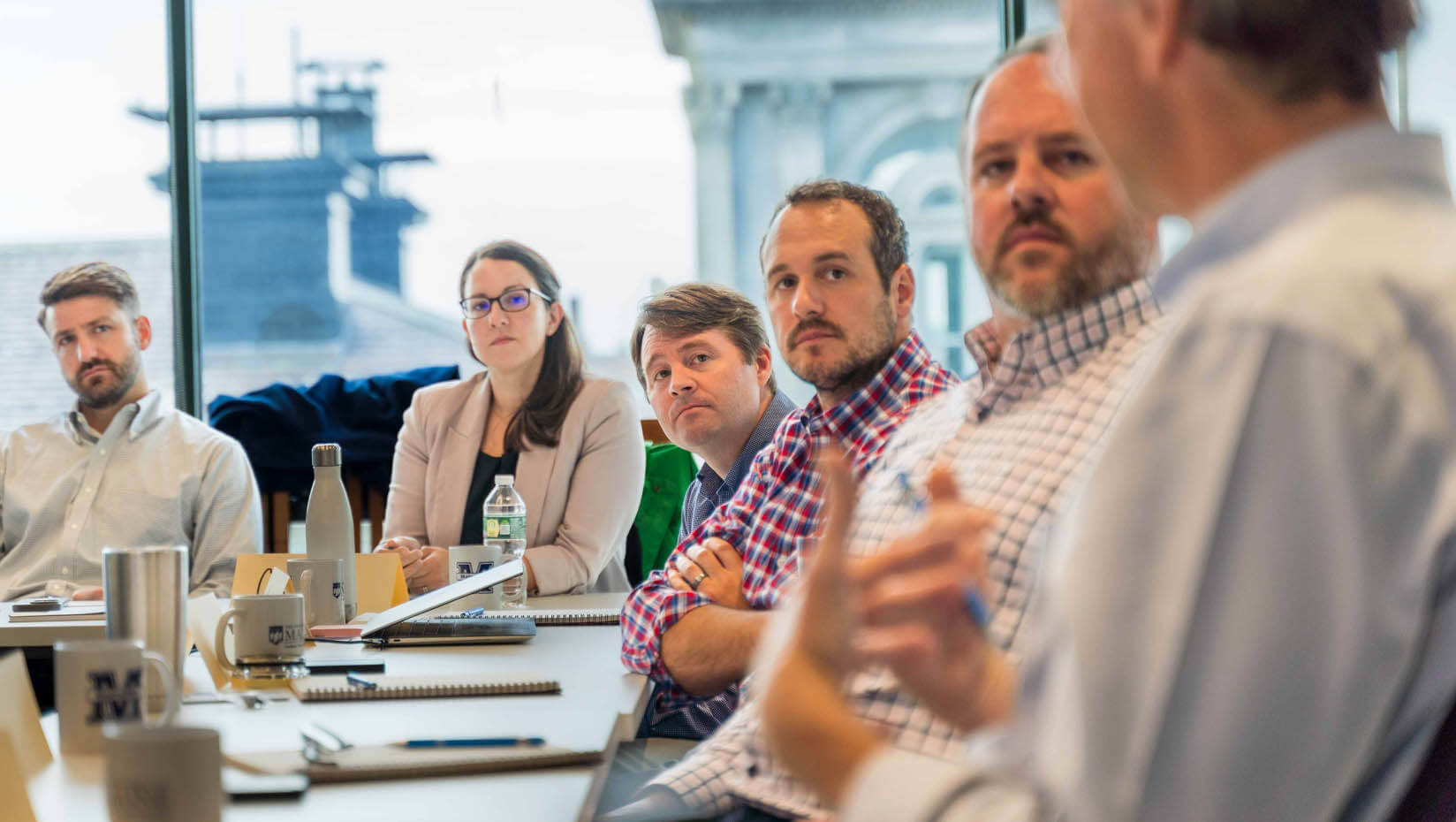 A photo of participants around a table