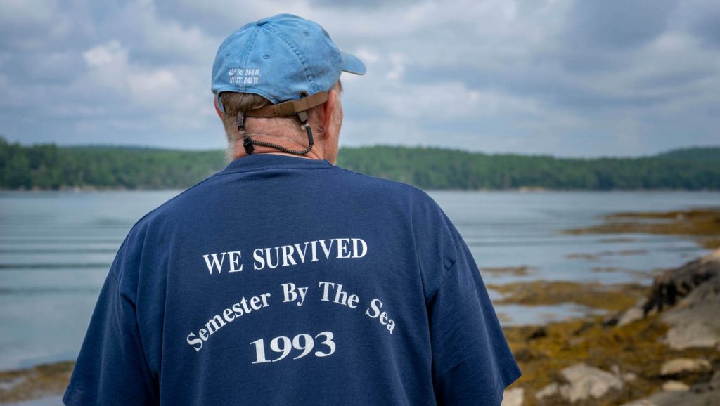 A photo of the back of a shirt that says "I survived Semester By the Sea 1993."