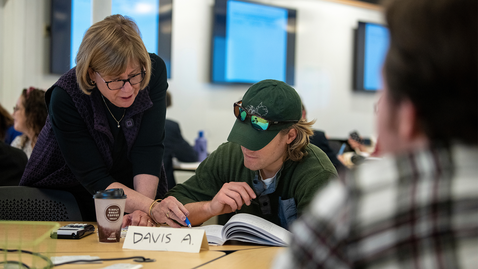 University of Maine President Joan Ferrini-Mundy helps a student with their coursework during a mathematics class in early 2020. Photo courtesy of the University of Maine.