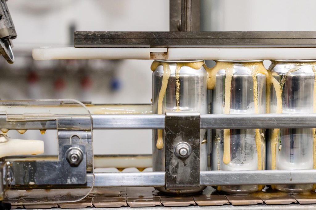 A photo of beer being canned