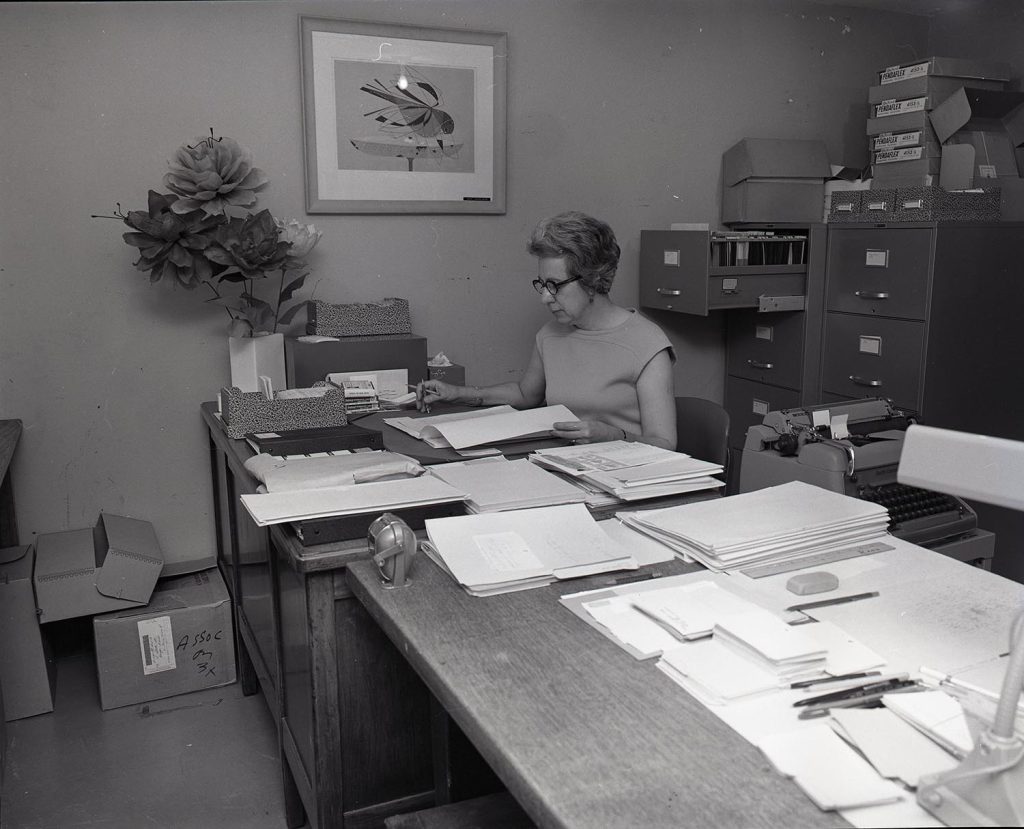 A photo of Frances Hartgen at her desk