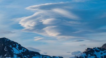 photo showing lenticular clouds over the Juneau ice field in southeast Alaska where the UMaine team intends to conduct research for this partnership project