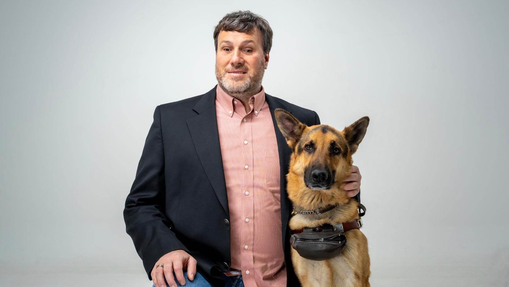 A portrait of Nicholas Giudice and his guide dog Norbert