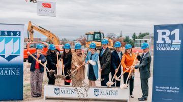 A photo of a group with shovels during a groundbreaking