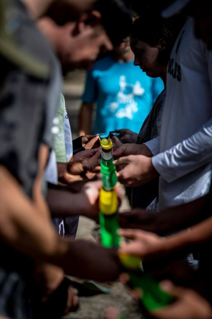 A photo of people taking part in a team building exercise