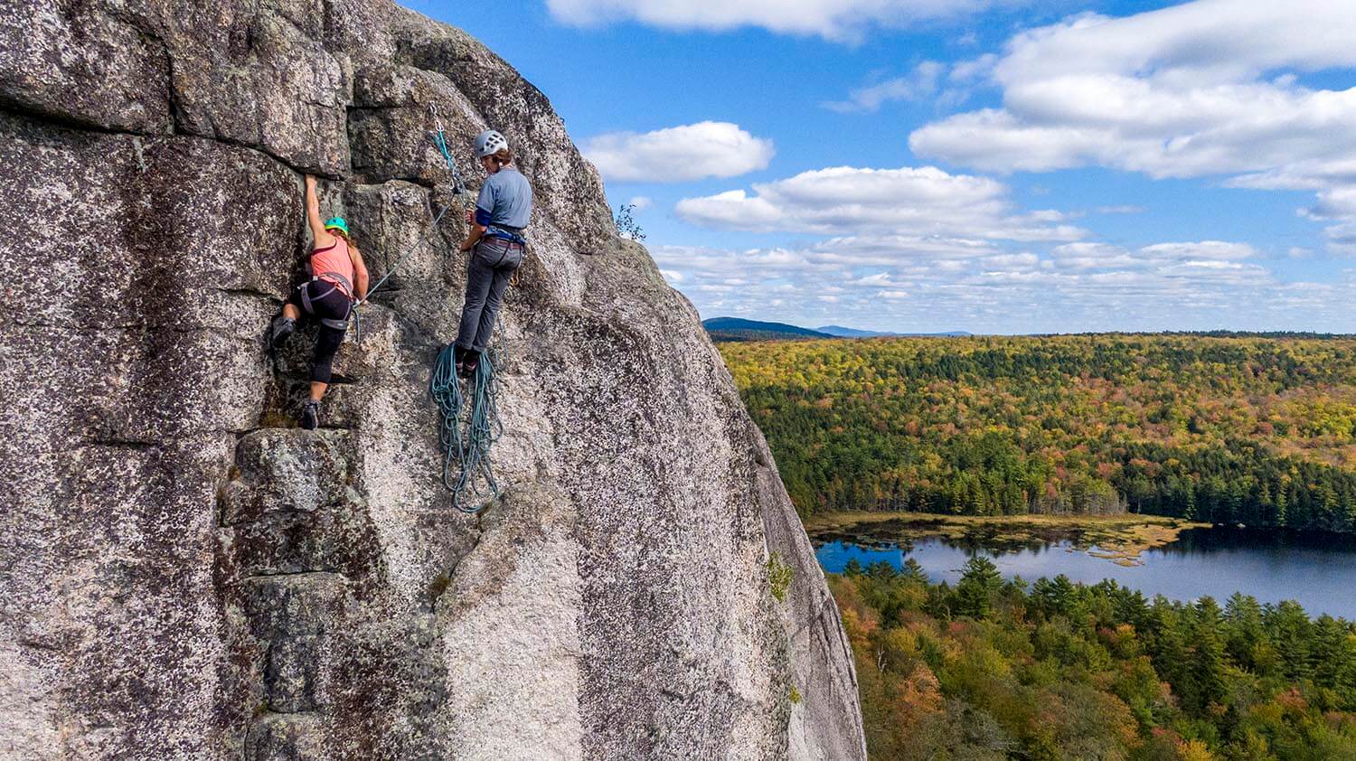 A photo of rock climbing on a cliff in fall