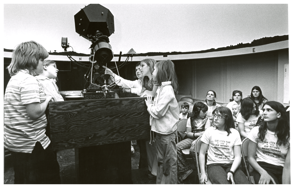 A photo of children with astronomy equipment