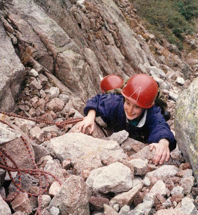 A photo of two people rock climbing