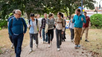 A photo of a group of students walking through downtown Bangor