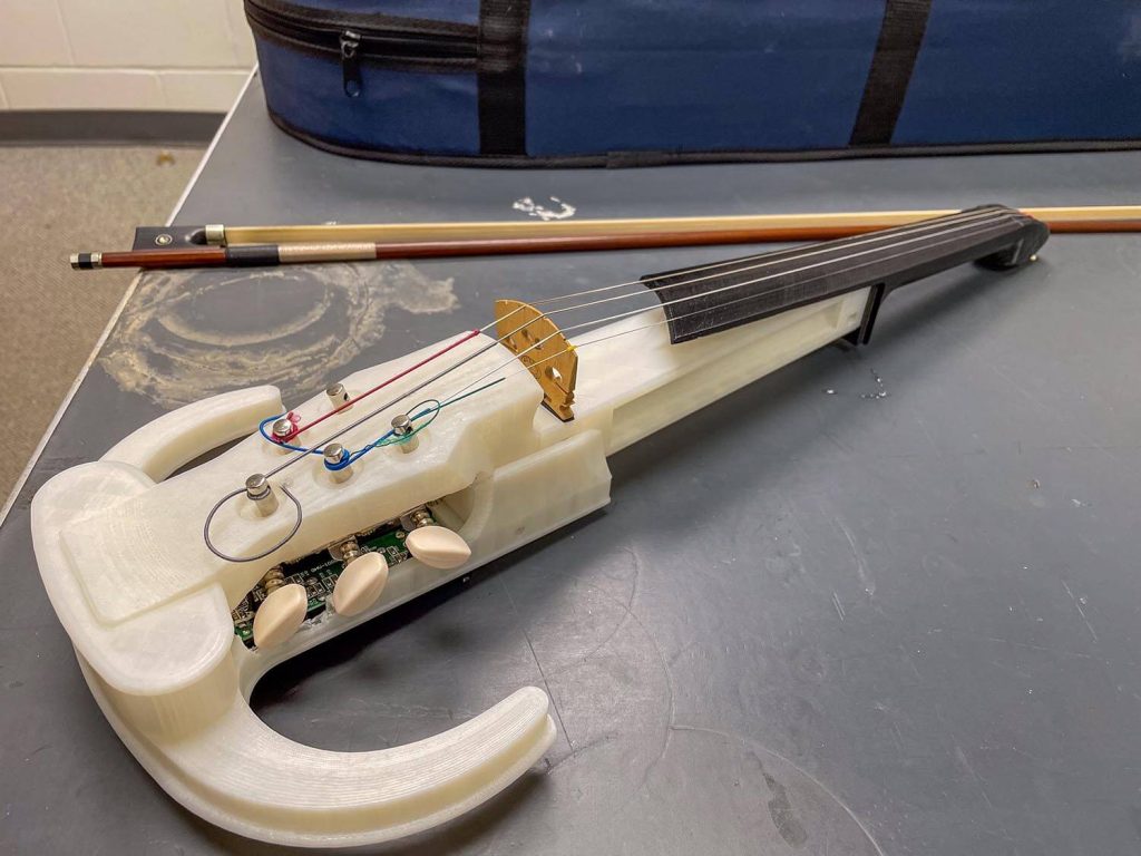 A photo of a 3D printed violin