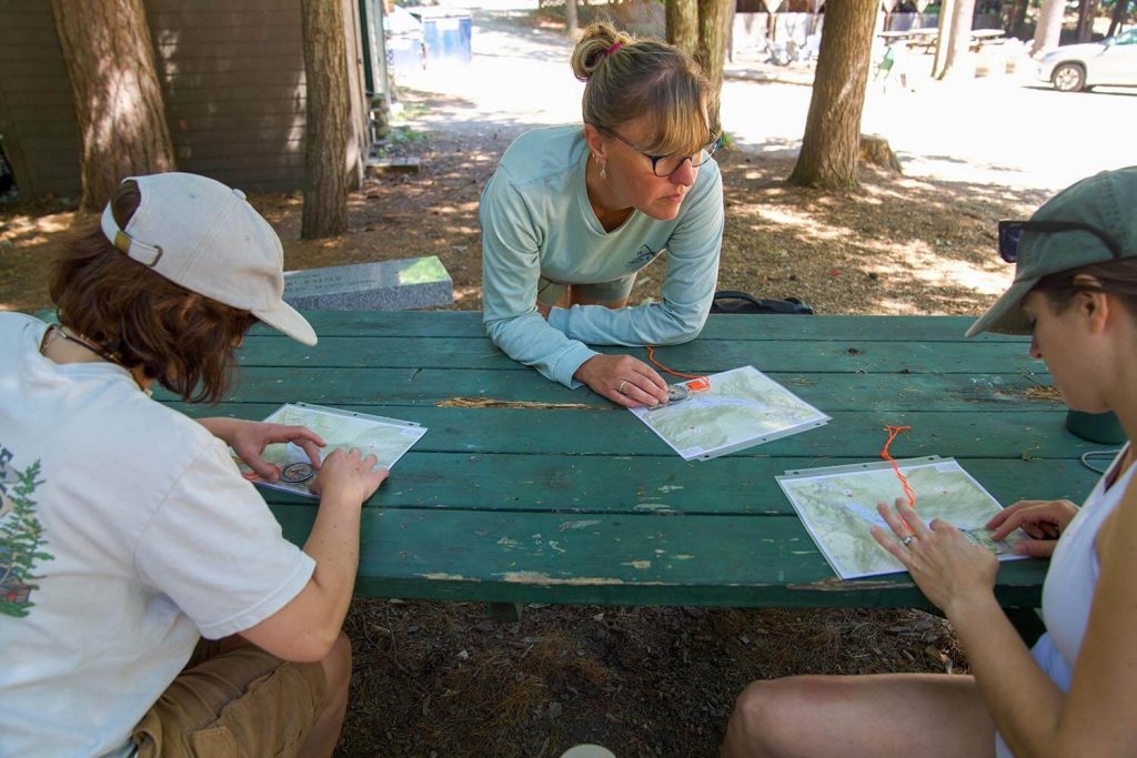 A photo of people sitting at a picnic table