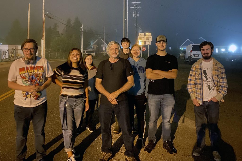 A photo of a group of students and their professor