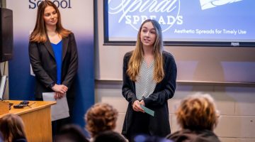 A photo of a person giving a presentation.