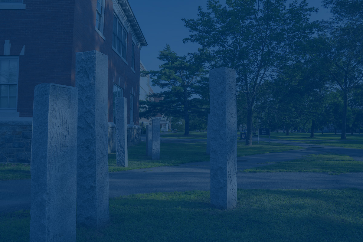 A photo of cement columns with a blue overlay. Link to Title IX website