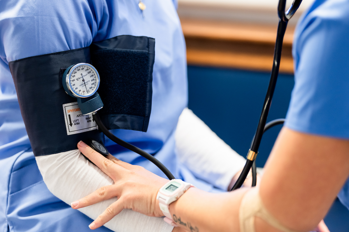 A photo of a blood pressure cuff on an arm
