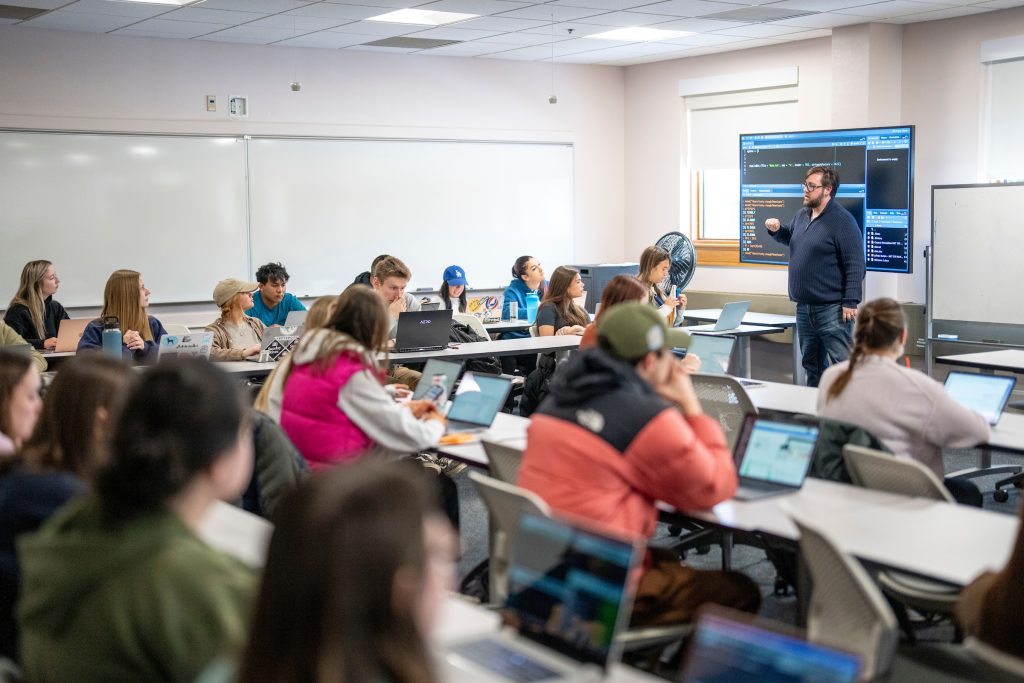 Maine Business School Assistant Professor of Marketing Rusty Stough instructs his students in Marketing Research inside DPC 205.
