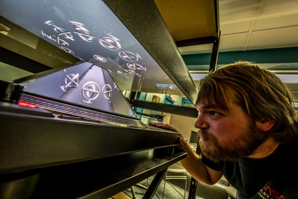 Students in Professor of Computer Science Terry Yoo's lab in the East Annex are exploring technology to assist with the hearing impaired as well as creating 3D holograms using principles of animation and a zoetrope turntable.