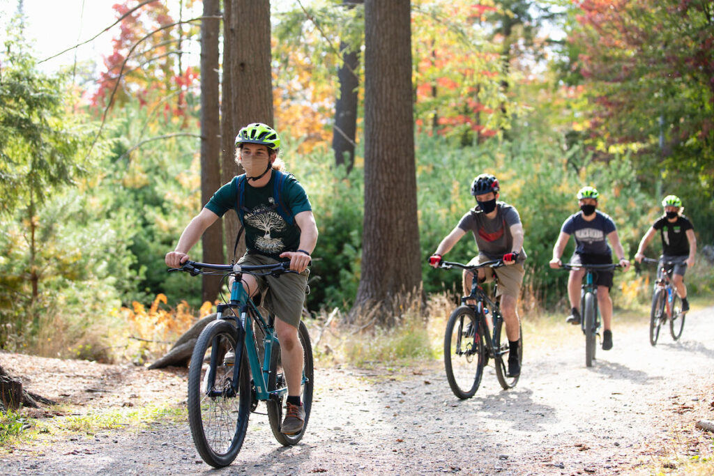 Group of bikers riding on a trail