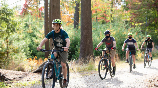 Group of bikers riding on a trail