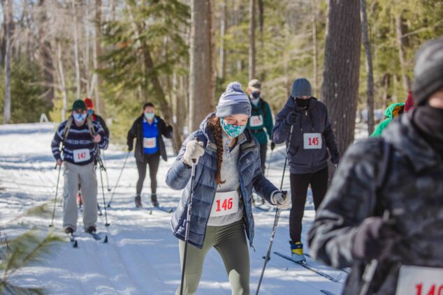 group of skiers at start of xc ski race