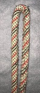 A folded rope with a dead spot in the middle causing the ends of the rope to touch.