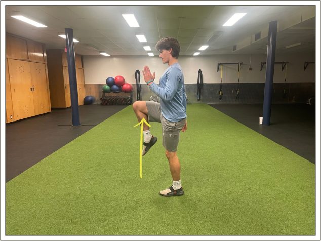 A student demonstrating the third step of high knees