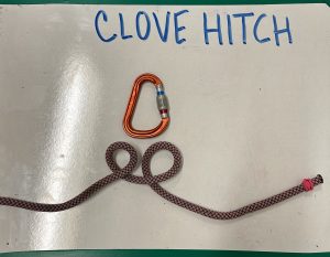 carabiner with rope below the words 'clove hitch'