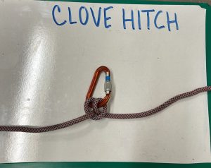 carabiner with rope below the words 'clove hitch'