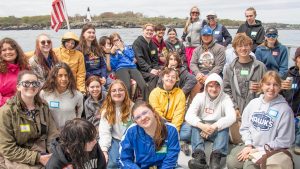 A photo of a group of students on Maine's coast