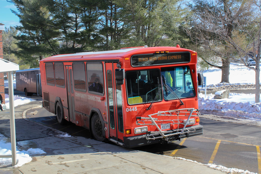 Red Community Connector bus with "Black Bear Orono Express" displayed on the sign.