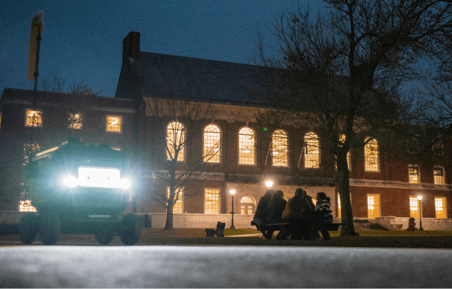 A photo of UMaine's Fogler Library at night