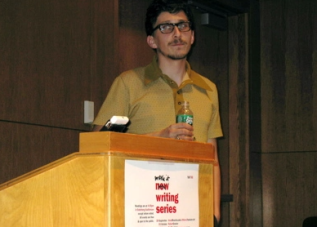 Matvei Yankelevich standing behind a podium