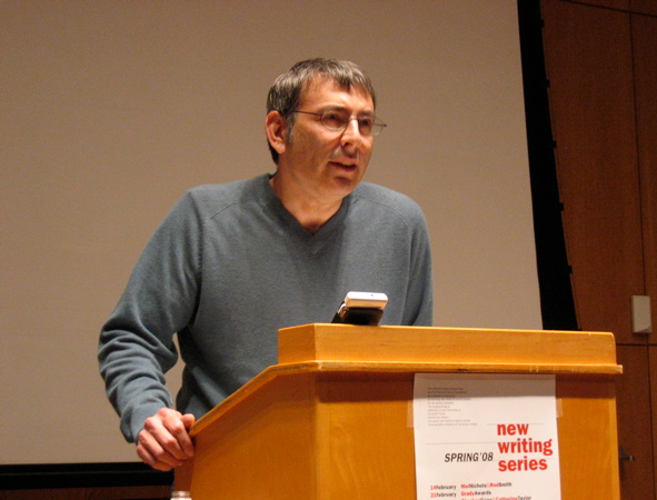 Ben Friedlander talking aloud behind podium