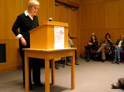 Jennifer Moxley reading behind a podium