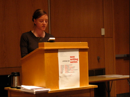 Julia Elliott reading behind a podium