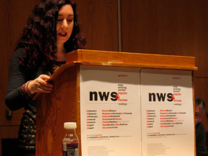 Nada Gordon speaking in front of a podium