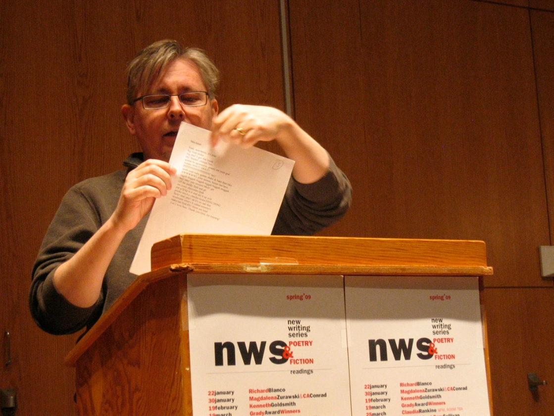 Gary Sullivan reading off of paper in front of podium