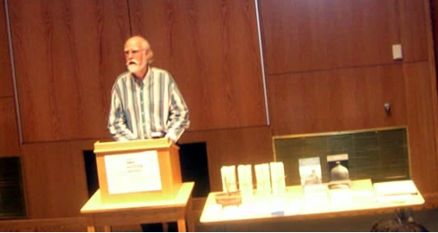 Sylvester Pollet is shown reading in the UMaine New Writing Series event in celebration of his Backwoods Broadsides Chaplet Series