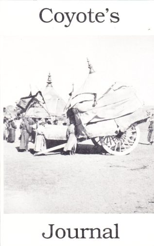 black and white photo of pioneers with their carriages