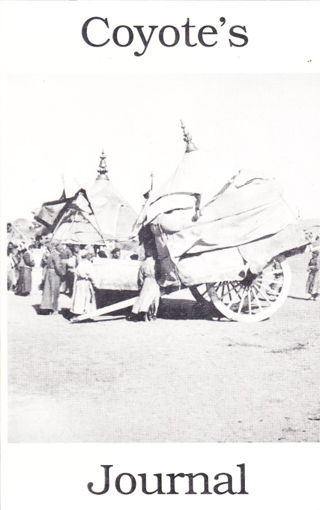 black and white photo of pioneers with their carriages