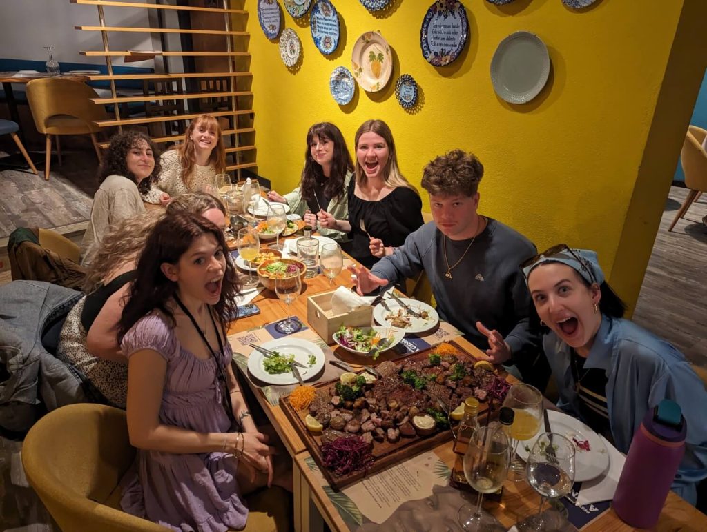 students around a dining table in portugal
